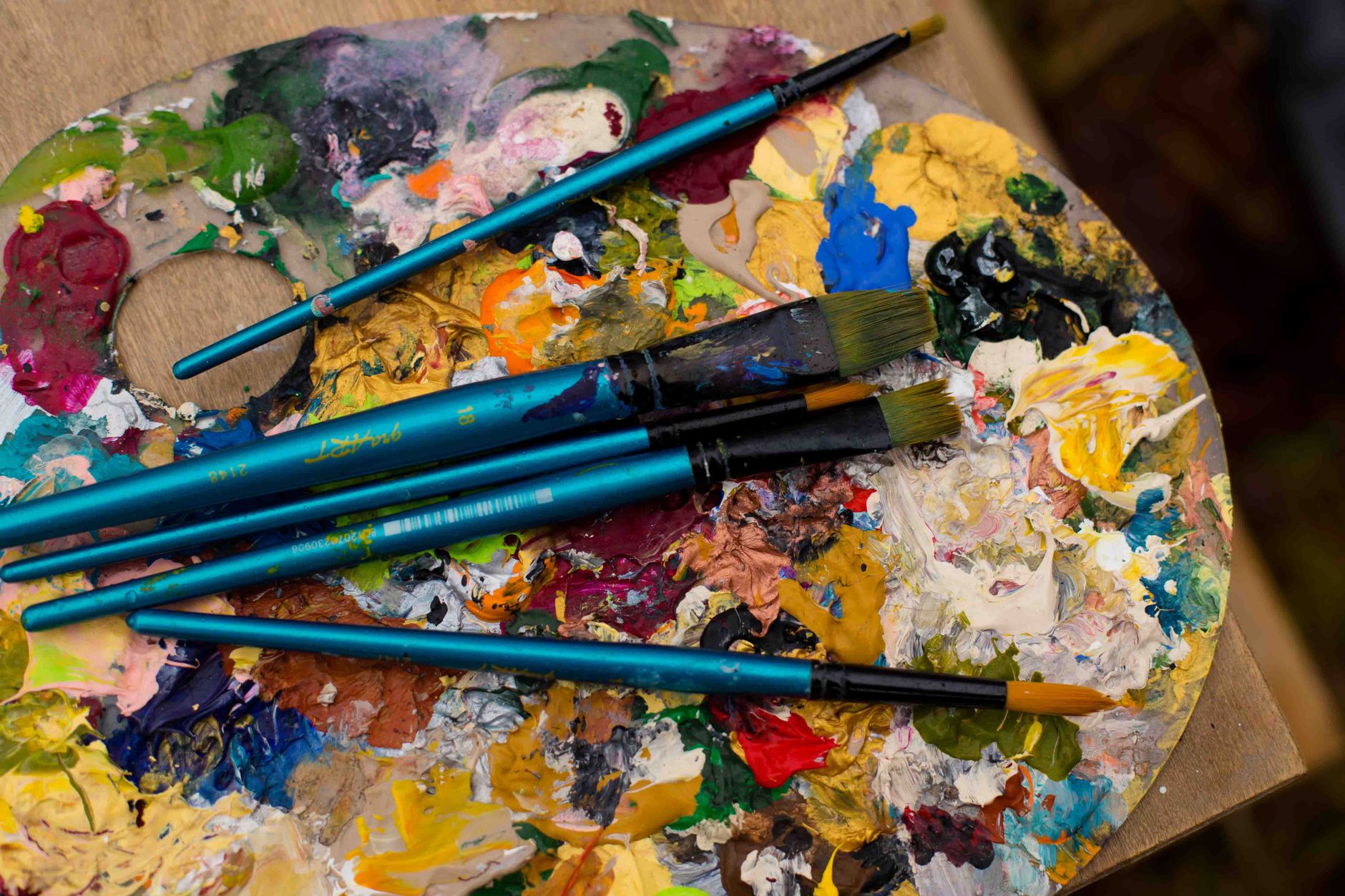Paintbrushes and colourful paint